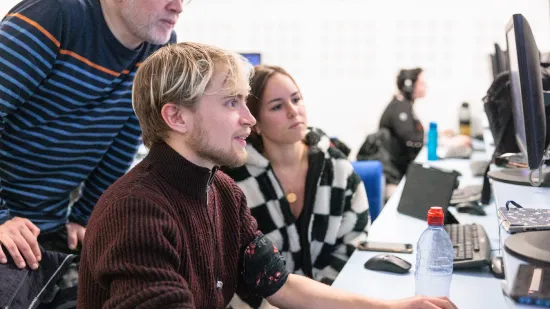 Students sitting at a computer