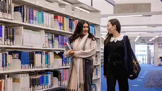 Student getting book in LRC