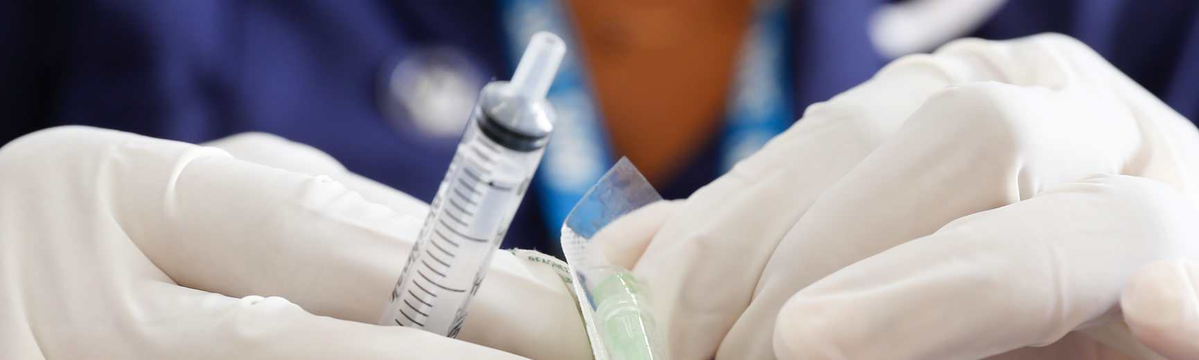 Nurse using needle