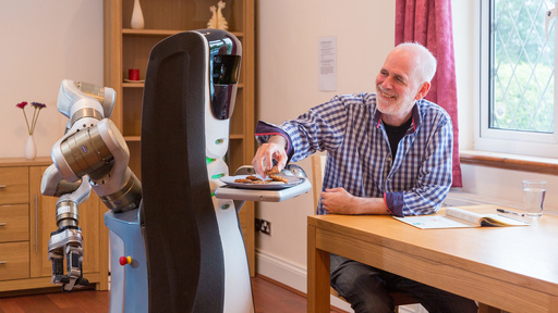 Robot helping elderly man