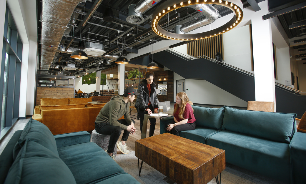 Students in bar and sofa area