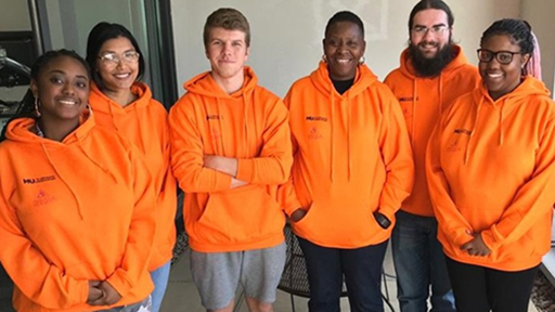 a group of student ambassadors smile to camera