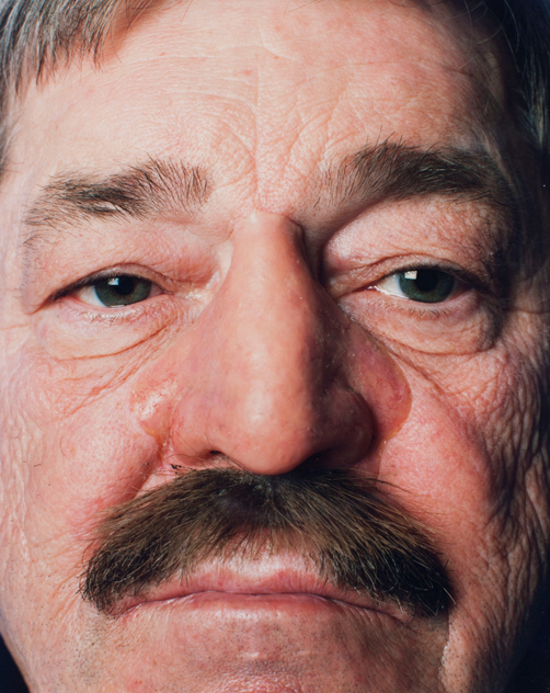 Close-up of a man's face with a moustache