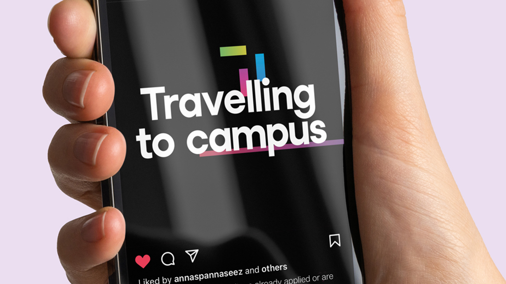 hand holding an iPhone, displaying a social media post by the university of hertfordshire