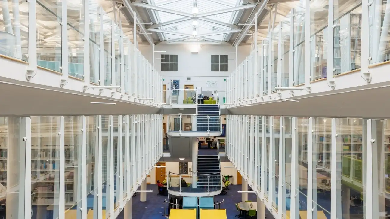 Inside of the LRC showing stairs in the middle and study spaces