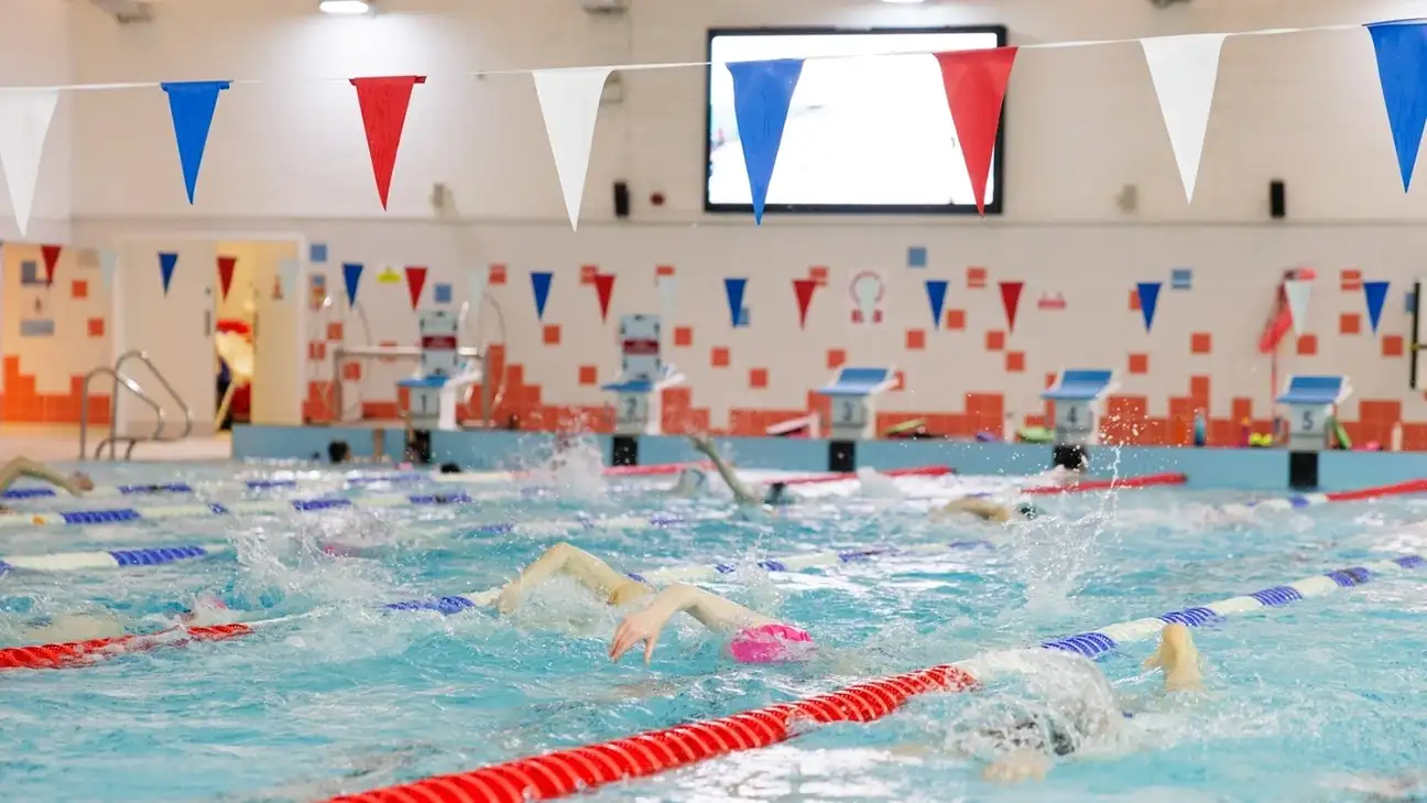 people swimming in lanes 