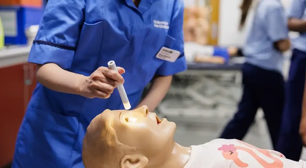 Nursing students working on dummy 