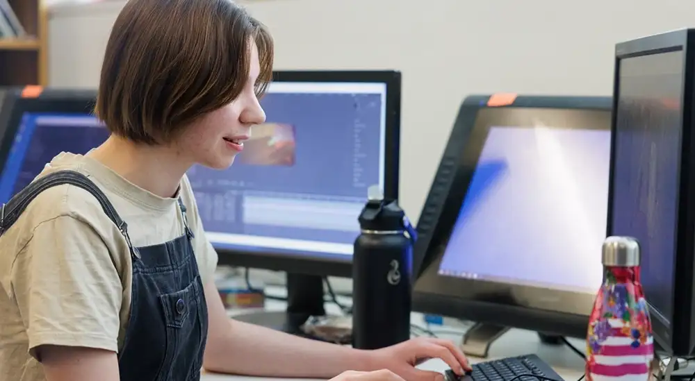 A student working on a desktop computer
