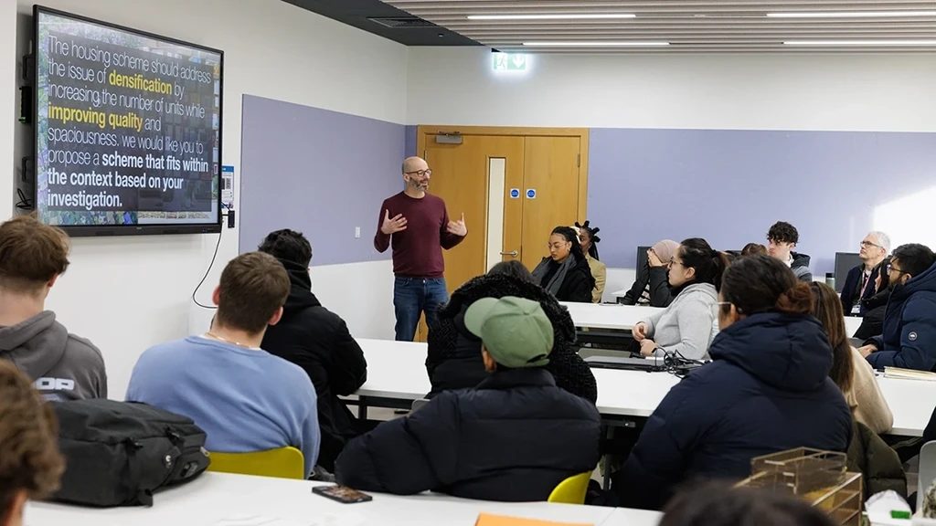 A lecturer talking to their class