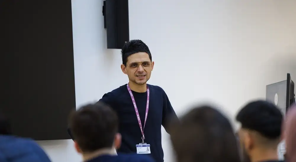 A lecturer talking to their class