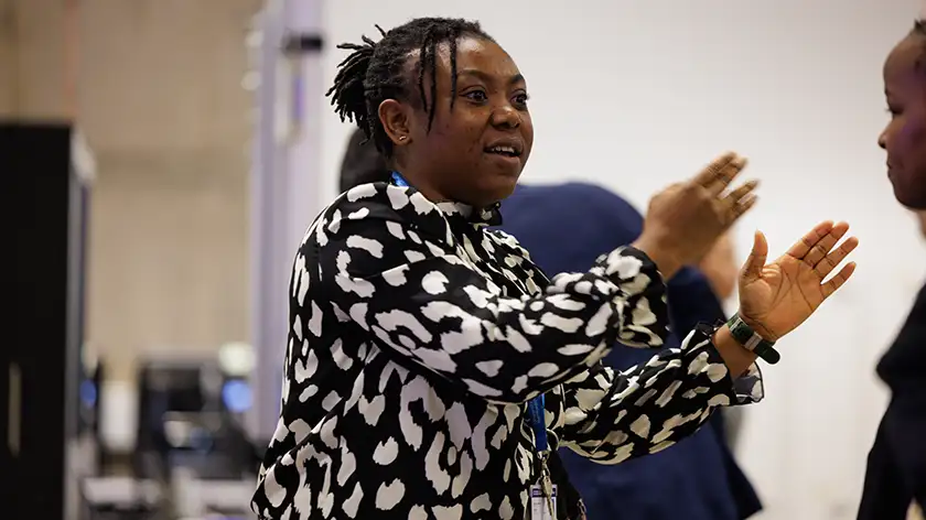A lecturer talking with expressive hands