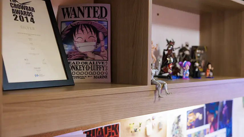 Shelf with awards and items on it 