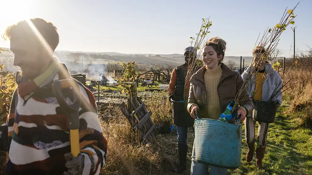 People carrying plants 