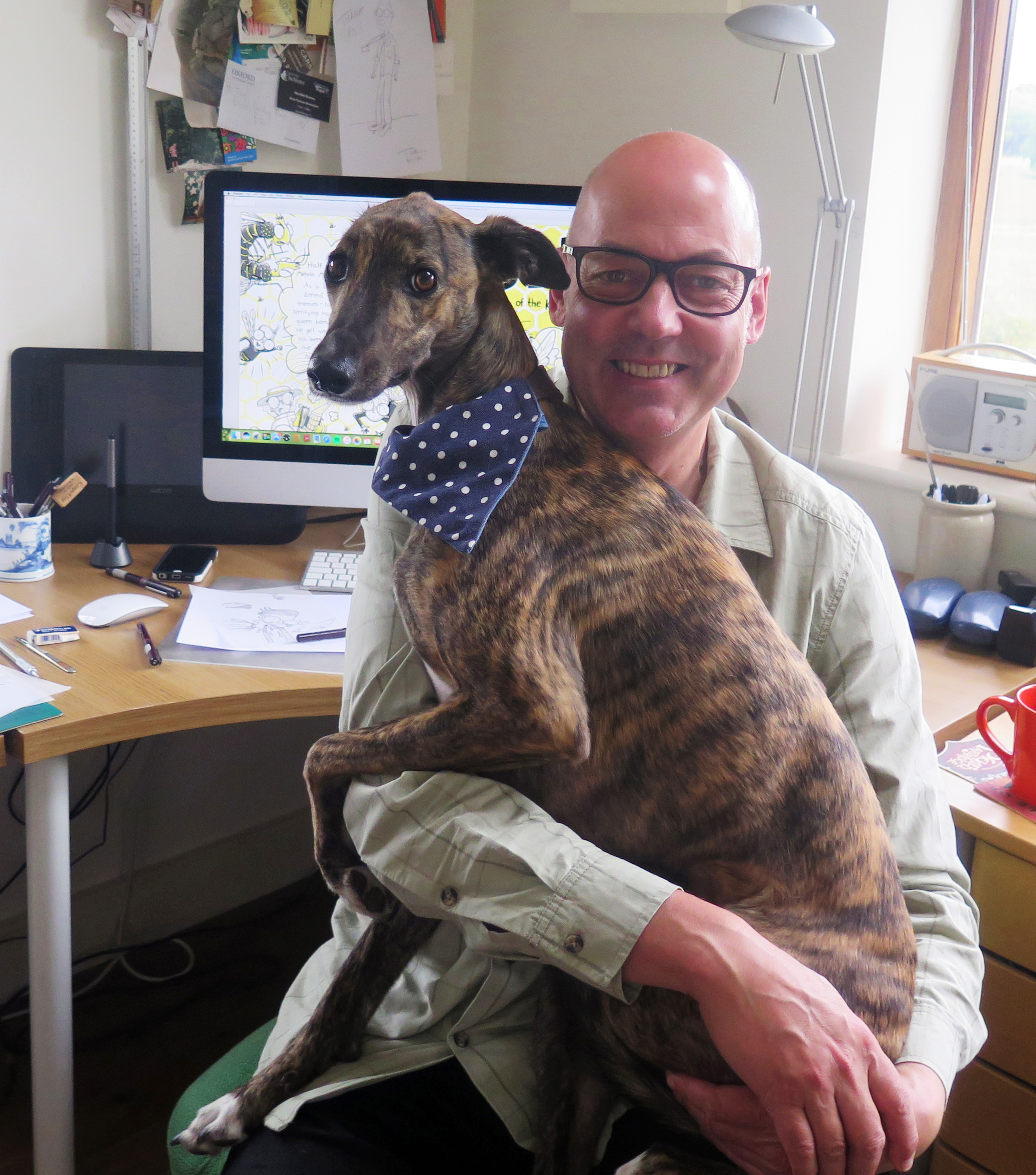 Picture of Tony holding Betty the dog