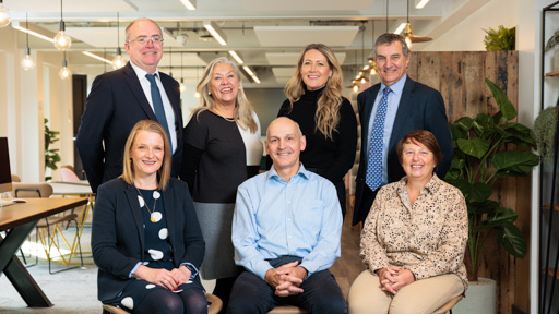 VCE group portrait shot in the Enterprise Hub on de Havilland campus