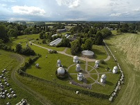 aerial shot of the observatory, showing the eight domes and the Patrick Moore Building