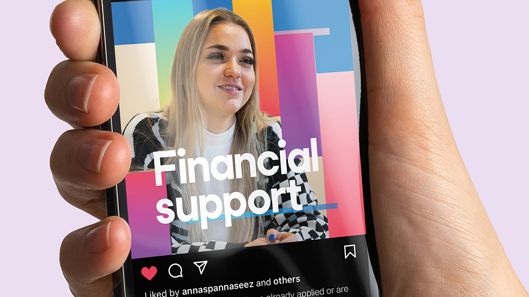 hand holding an iPhone, displaying a social media post by the university of hertfordshire