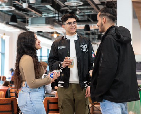 Students talking in the Enterprise Hub