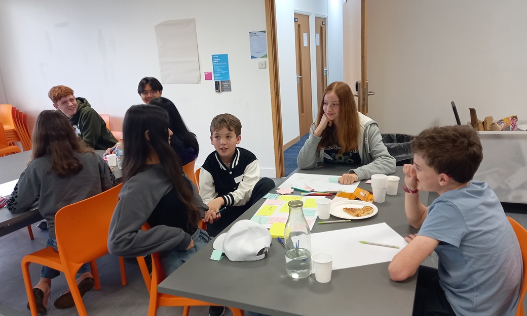 A group of young people talking with one another