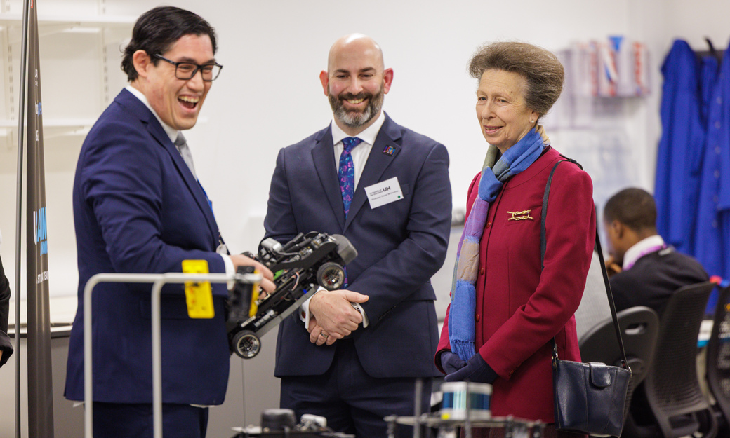 Princess Royal looking at a modal racing car