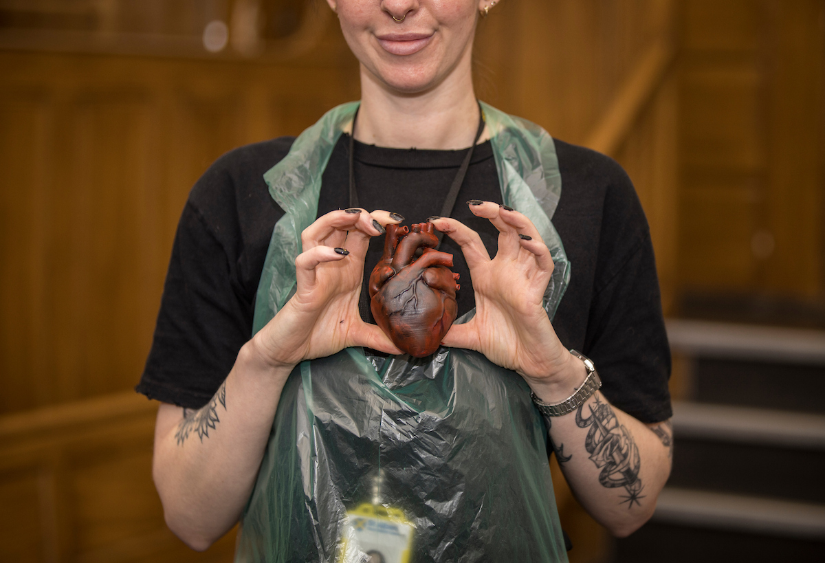 Woman holding a painted 3d printed heart