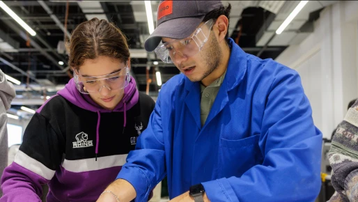 Two Student looking at paper 