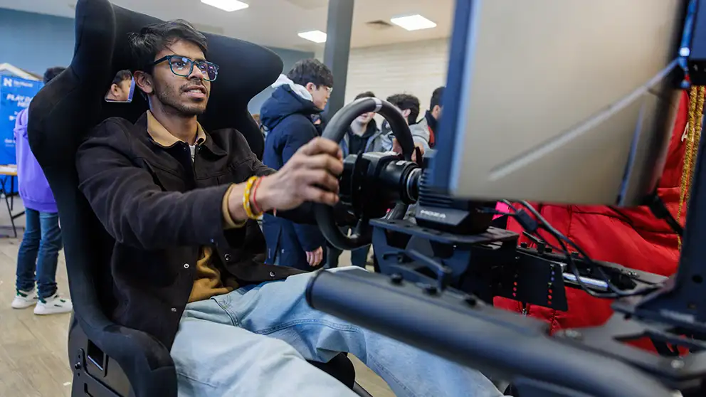 Student in a racing simulator