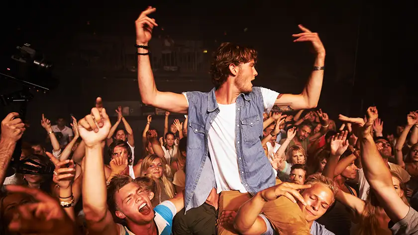 Person sitting on a person shoulders
