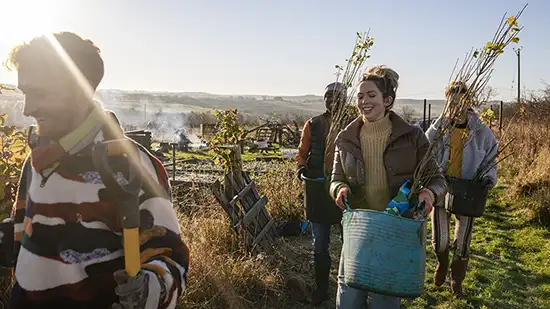 People carrying plants 
