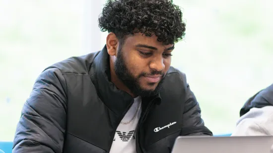 A student working on a laptop