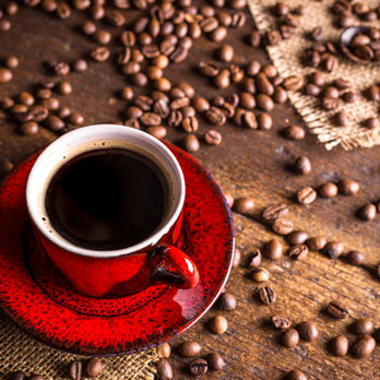 Coffee cup with coffee beans