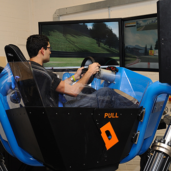 A student practises in our automotive engineering cruden simulator