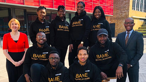 a group of BAME advocates smile to camera