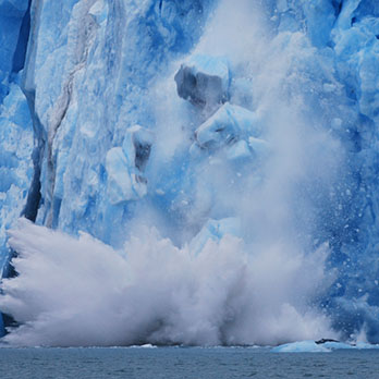 glaciers melting and crashing into the ocean