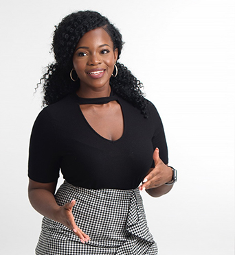 Felicia Odamtten in black top and black and white check skirt