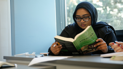 Student reading a book 