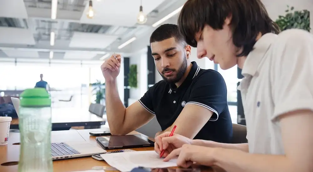 A student working alongside another student