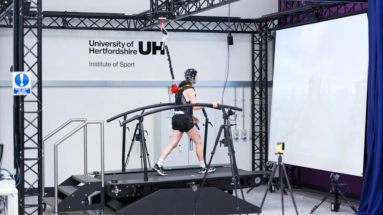 A person on a treadmill with wires