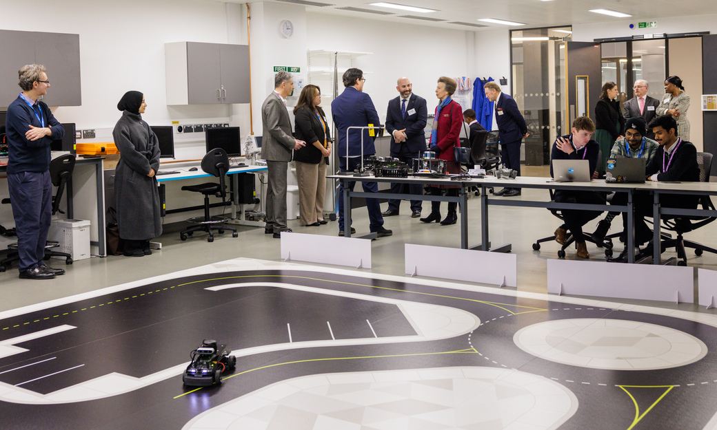 Princess Royal looking at a lab in Spectra