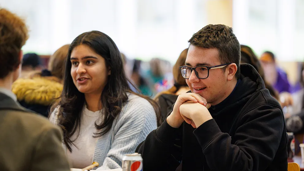 Two students sitting at table