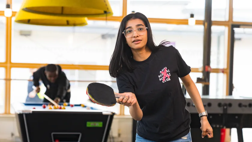Student playing table tennis