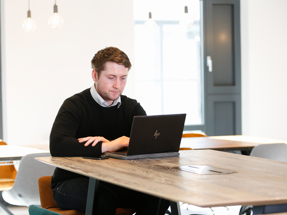 Man on laptop at desk