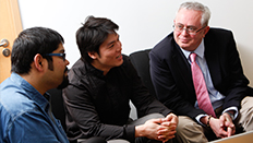 Three men in conversation