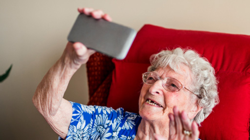 Elderly woman using mobile phone