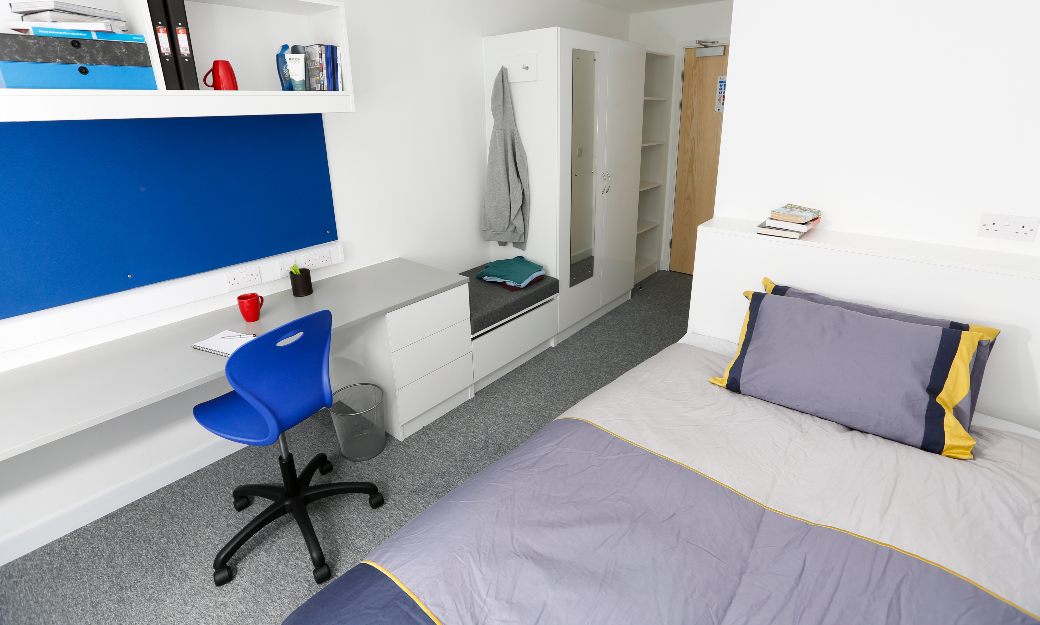 Bedroom with blue duvet