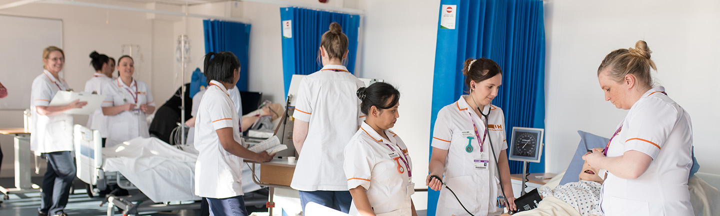 Nursing associates in training in a ward mobile