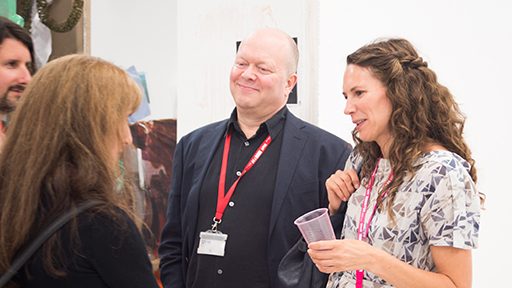 Ian Wilcock, a member of the Media Research Group, chats with colleagues