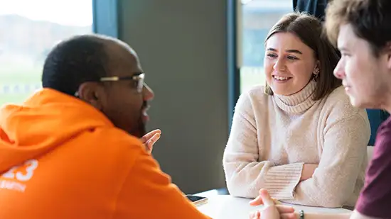 Students talking and smiling