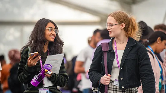 Two students talking to each other