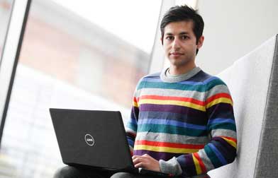 Male student with laptop